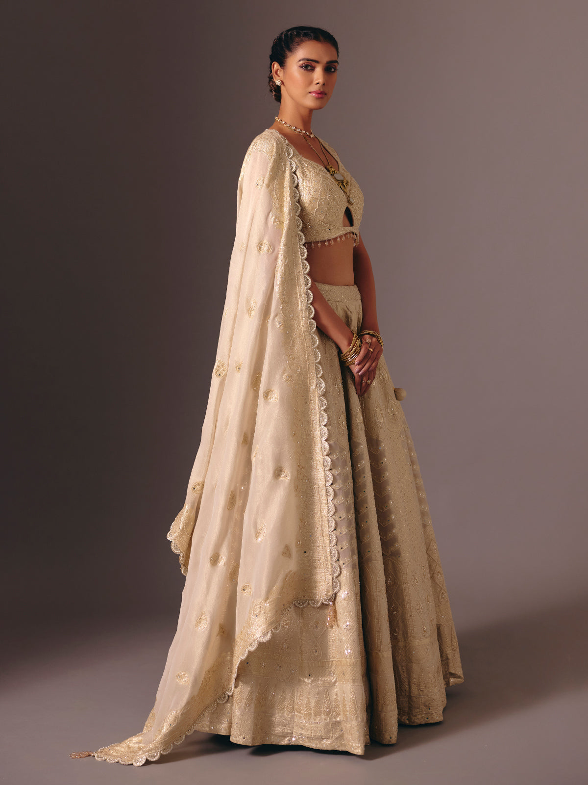 Gold banarasi tissue silk lehenga choli with mirror detailing