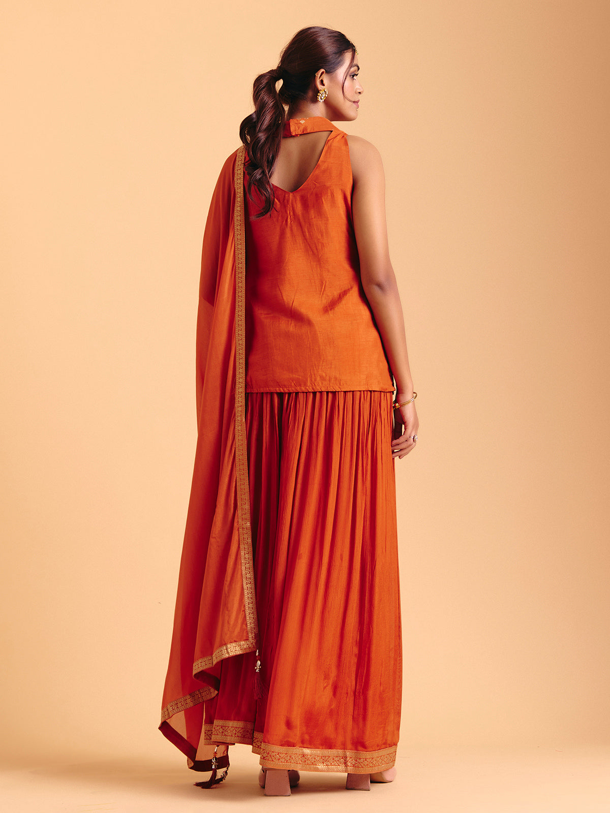 Orange tissue silk palazzo suit with zari glow