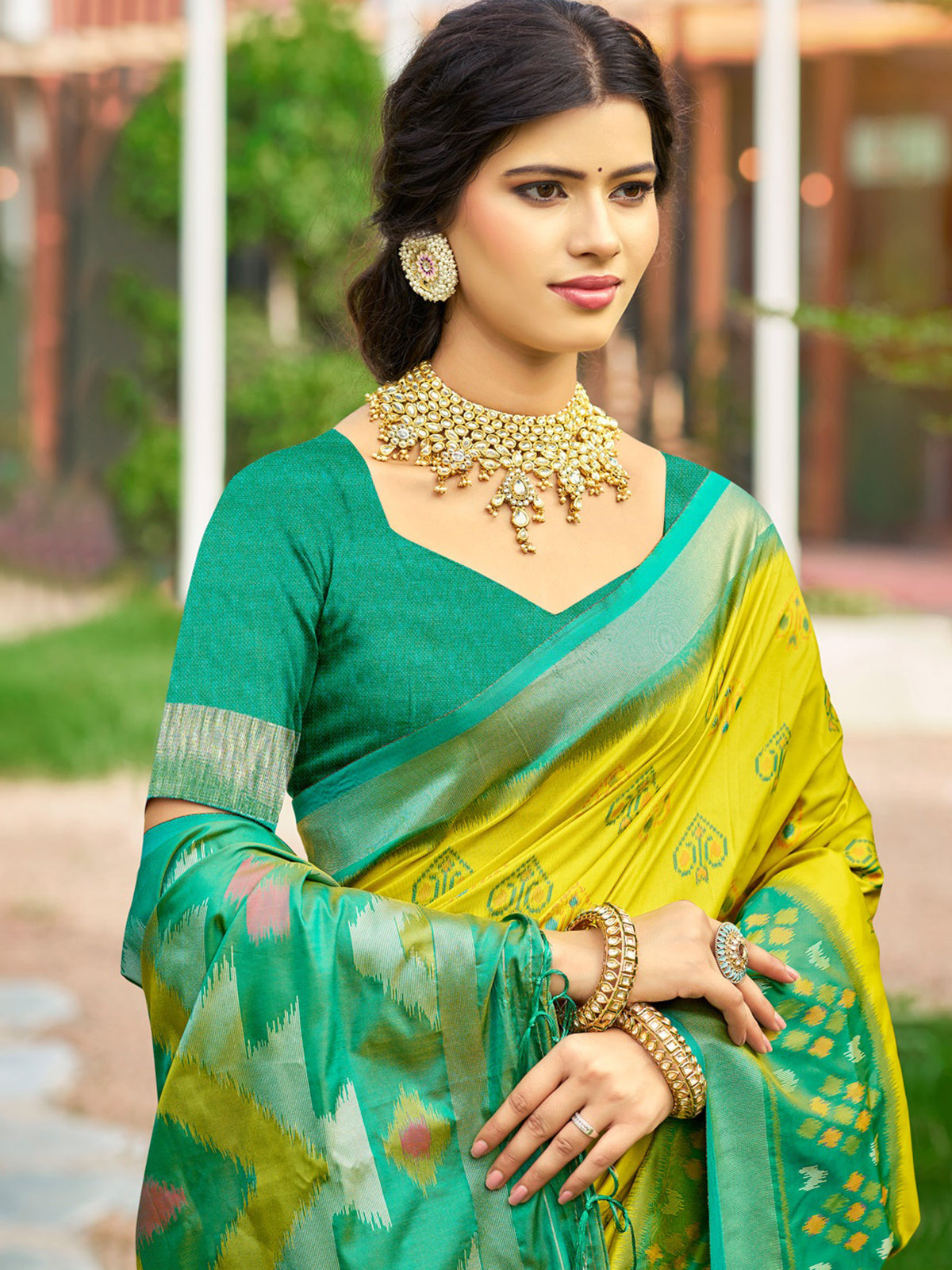 Yellow silk printed saree with contrast border and blouse