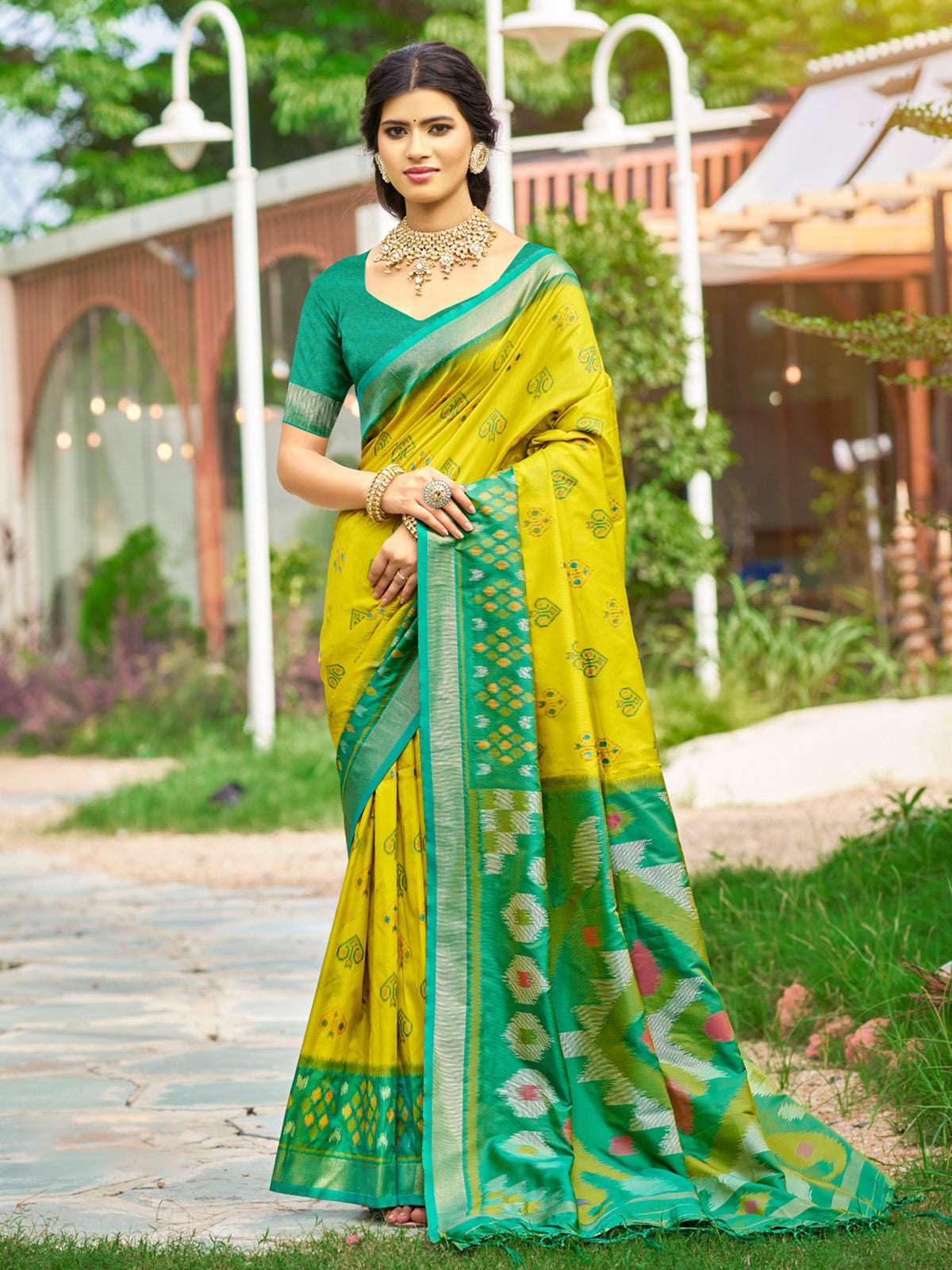 Yellow silk printed saree with contrast border and blouse