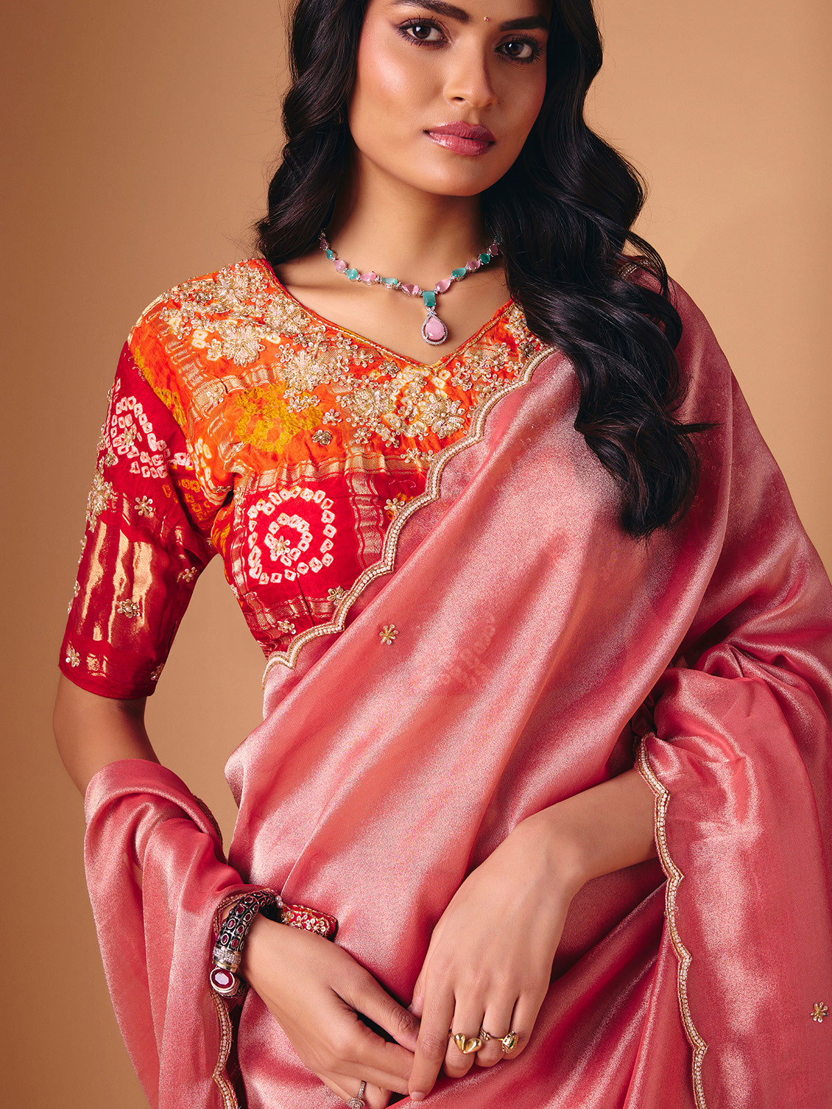 Peach tissue silk embellished saree