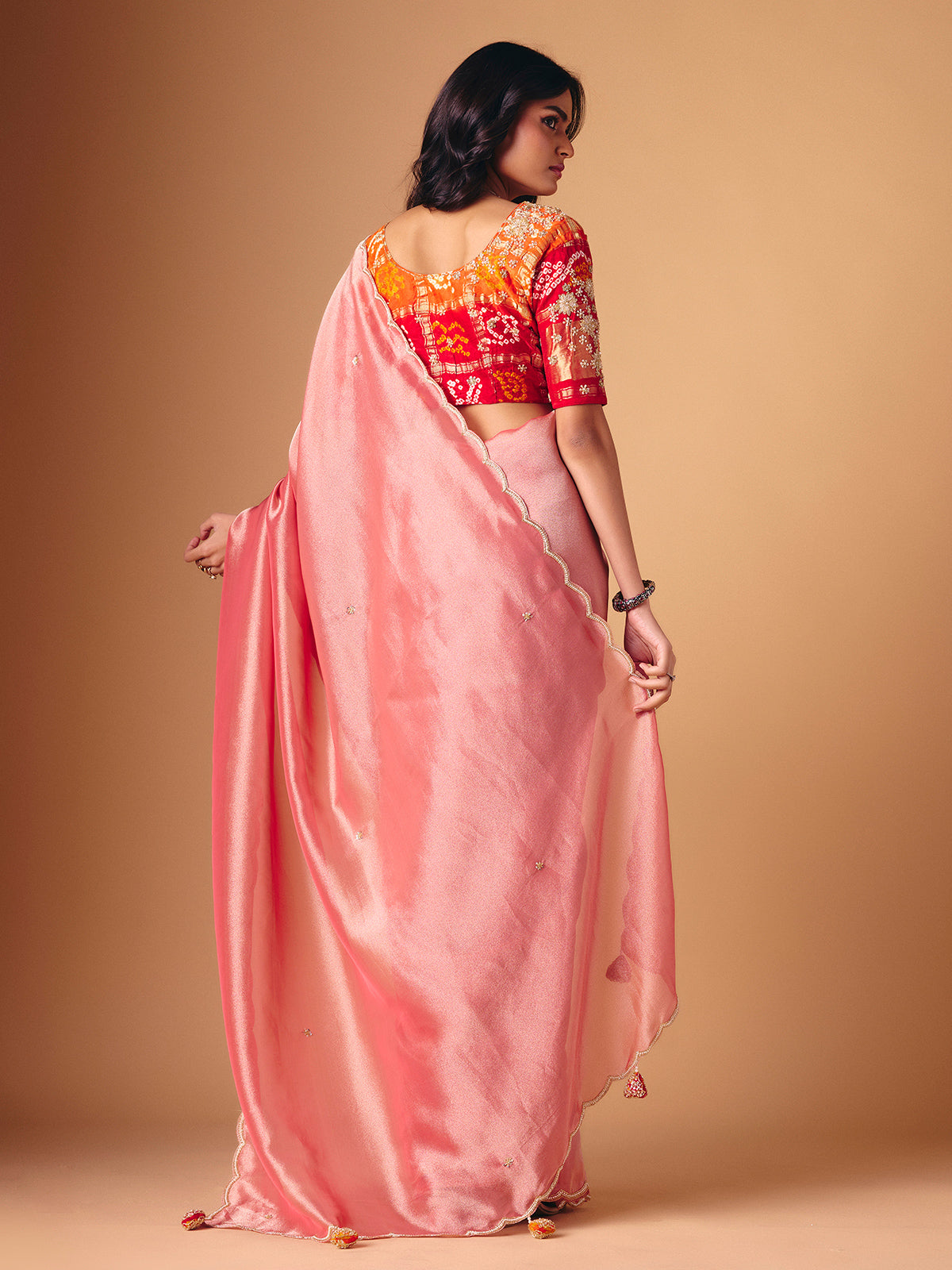 Peach tissue silk embellished saree