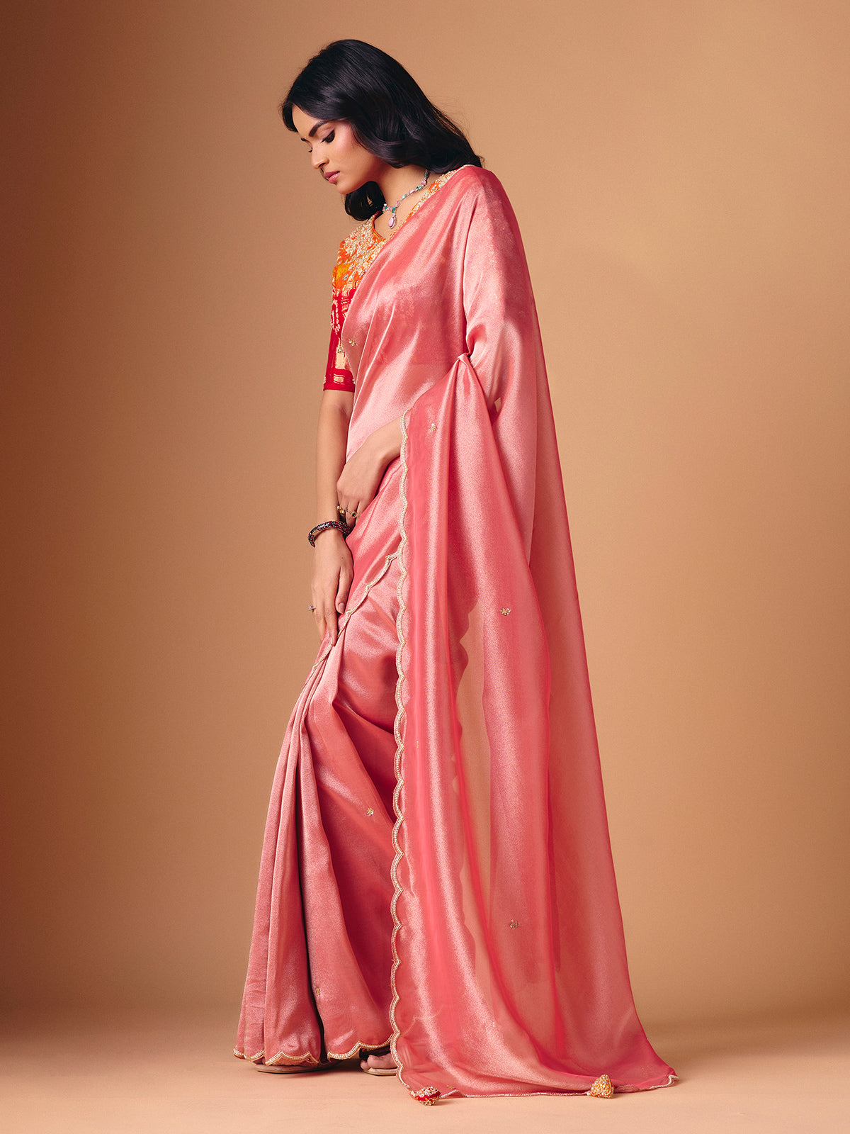 Peach tissue silk embellished saree