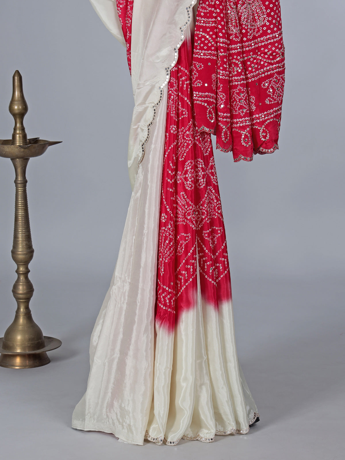Cream red bandhej printed festive wear saree