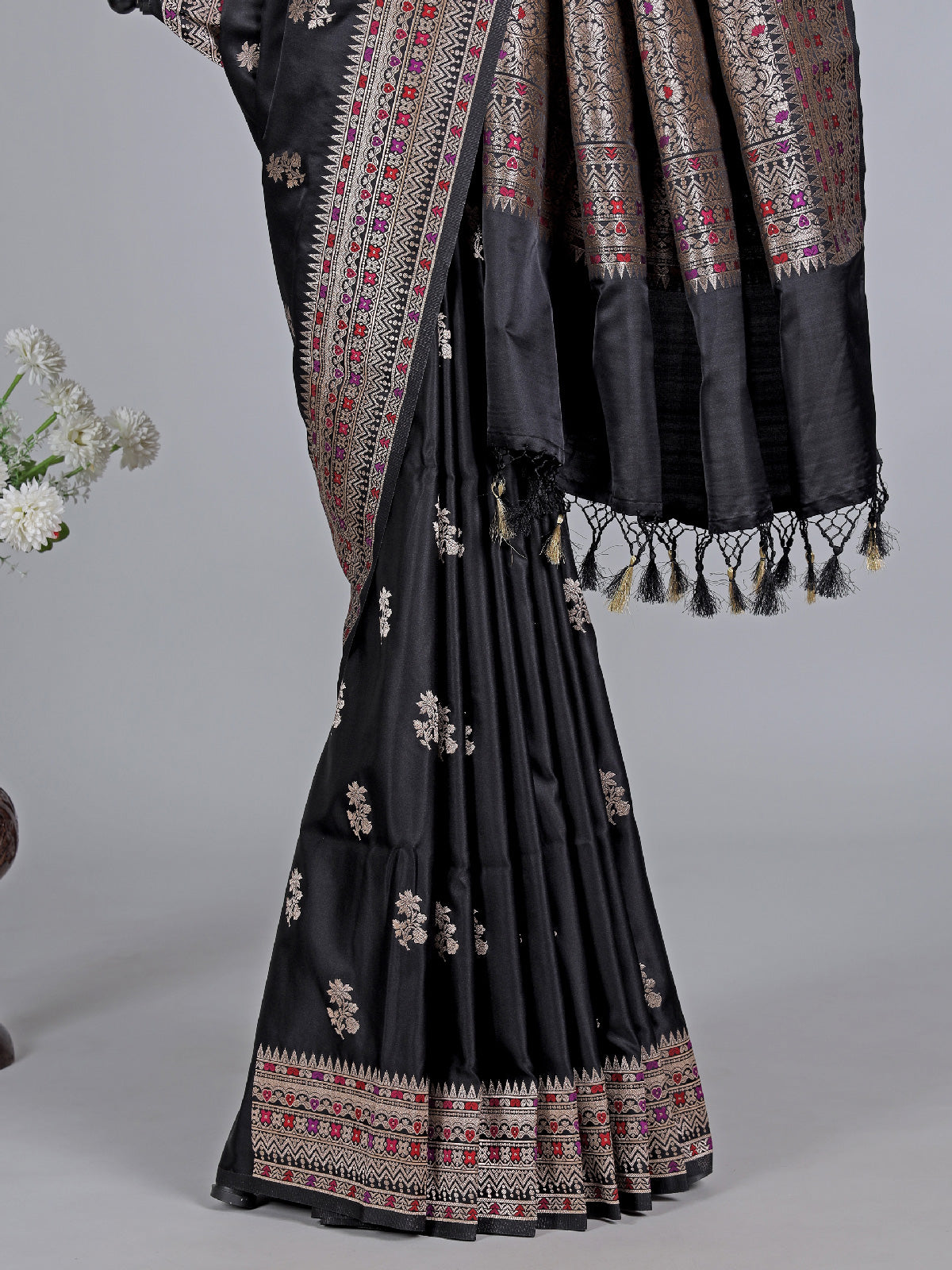 Black silk saree with zari and colorful motifs