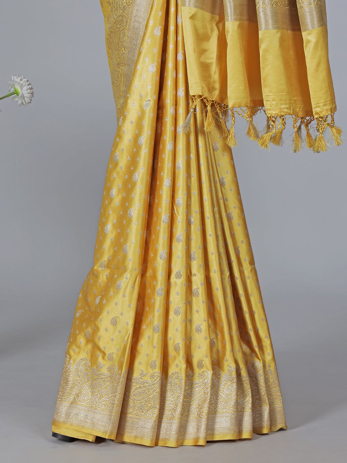 Yellow semi silk saree with festive zari detailing