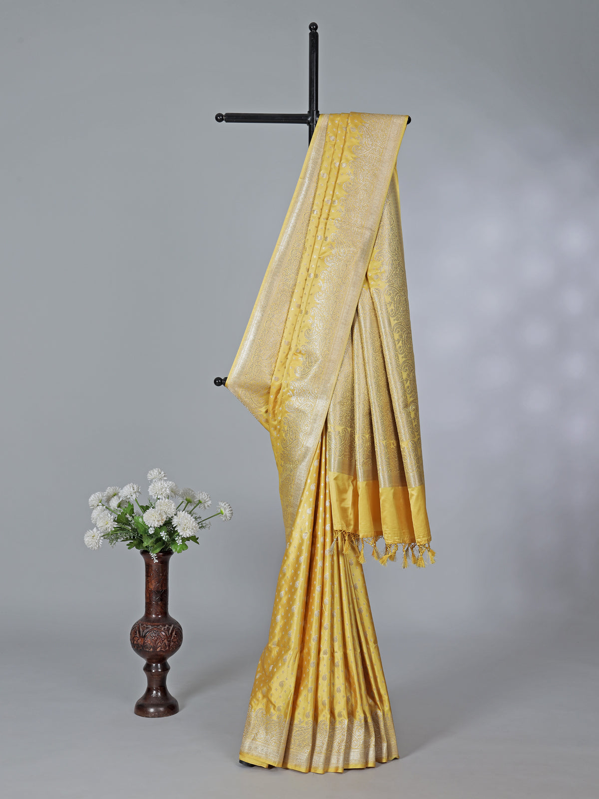 Yellow semi silk saree with festive zari detailing
