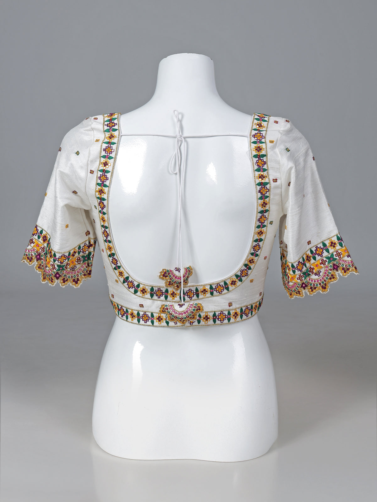 White raw silk aabla work round neck blouse