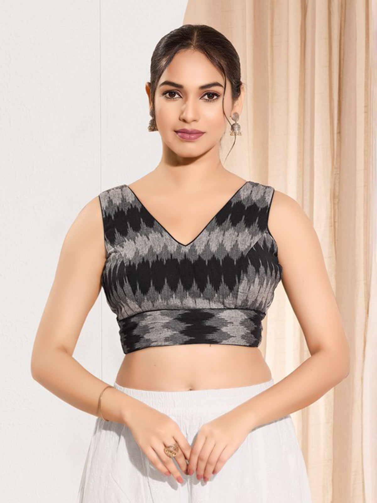 Black printed ikat silk sleeveless blouse