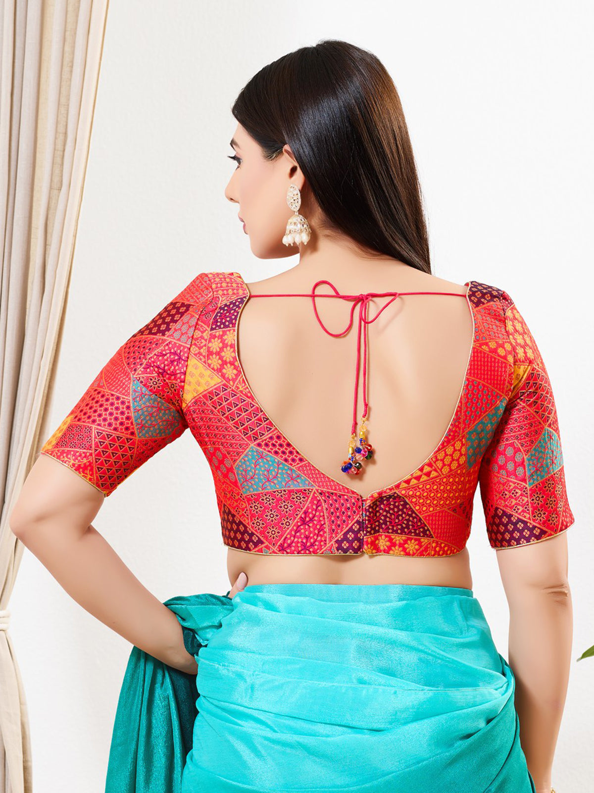 Red printed brocade V neck blouse