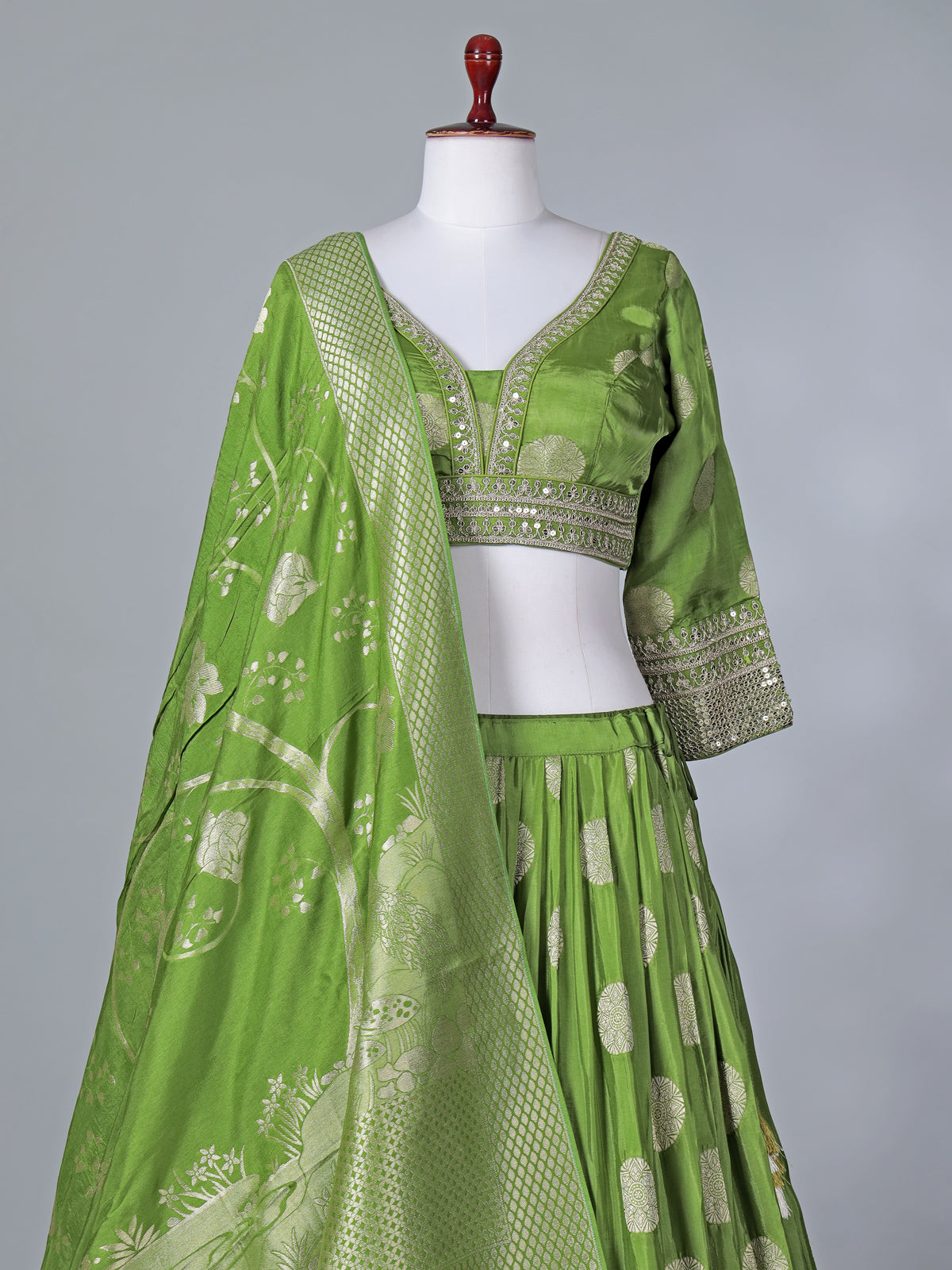Green wedding wear silk lehenga choli with zari glow