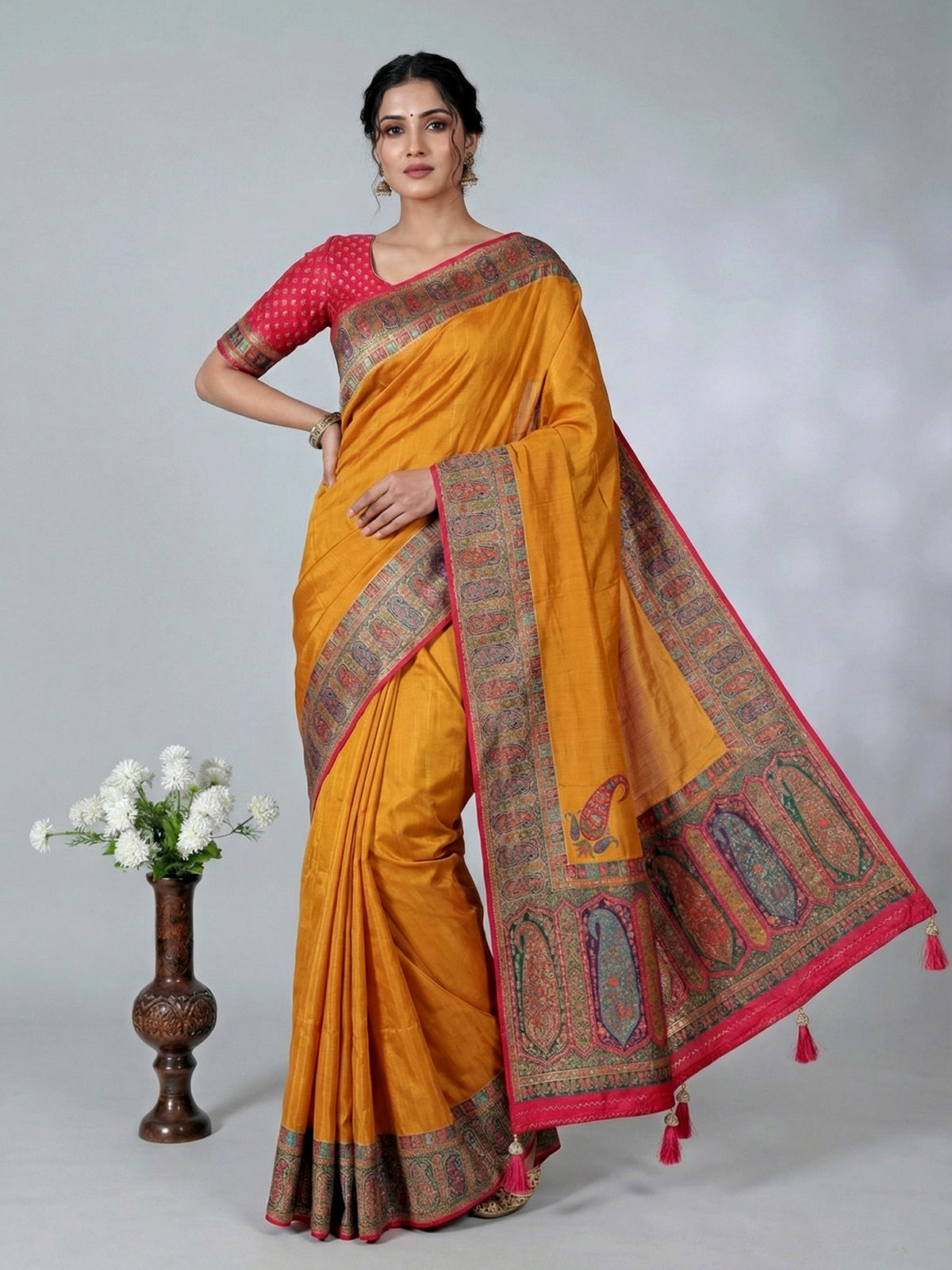 Mustard yellow art pashmina silk saree showcasing timeless embroidery