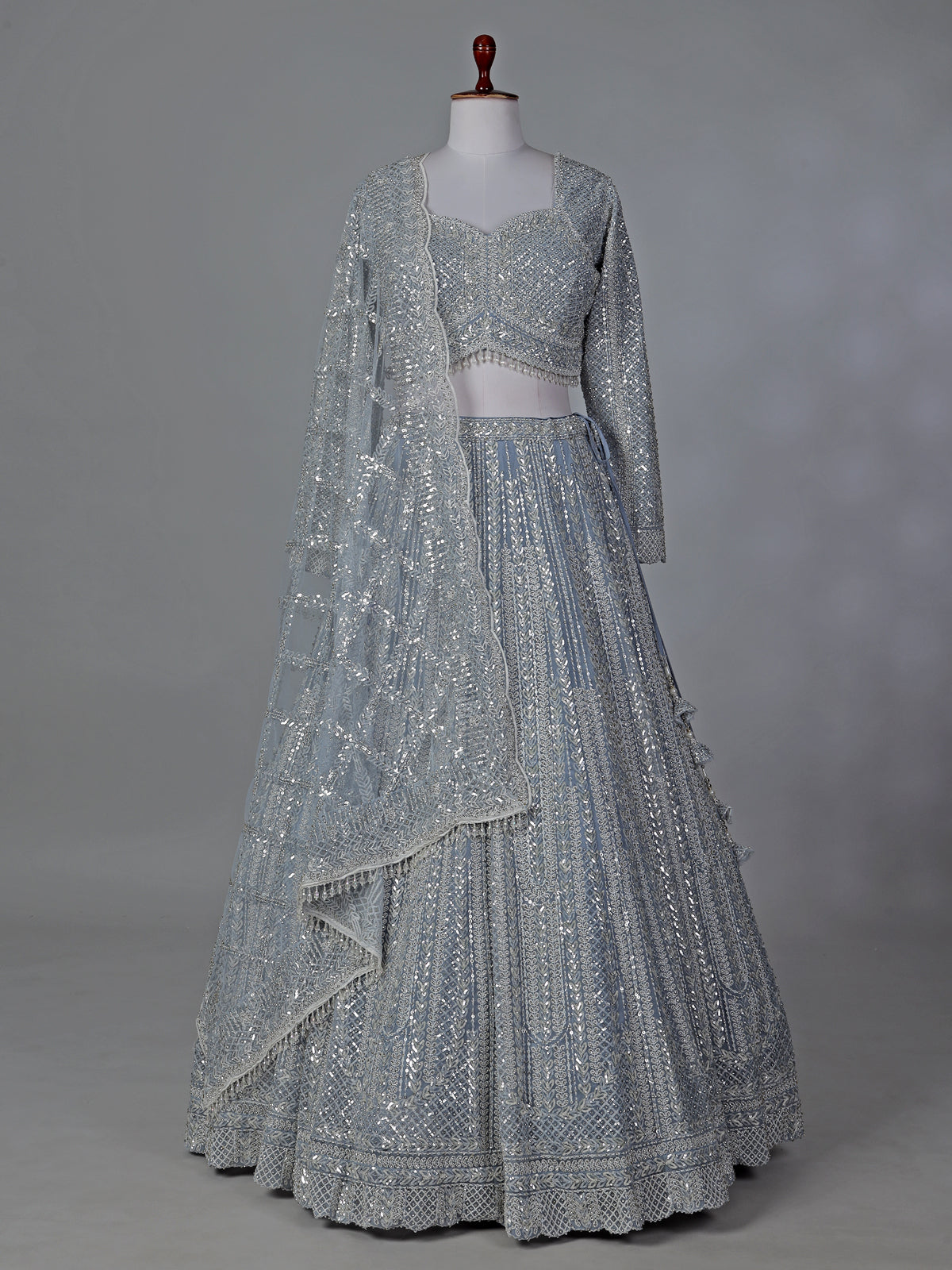 Grey wedding wear net lehenga choli with sequins detailing