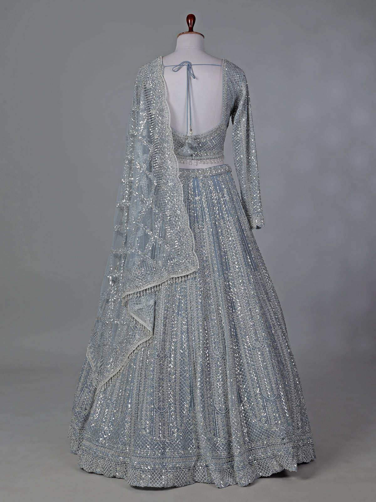 Grey wedding wear net lehenga choli with sequins detailing