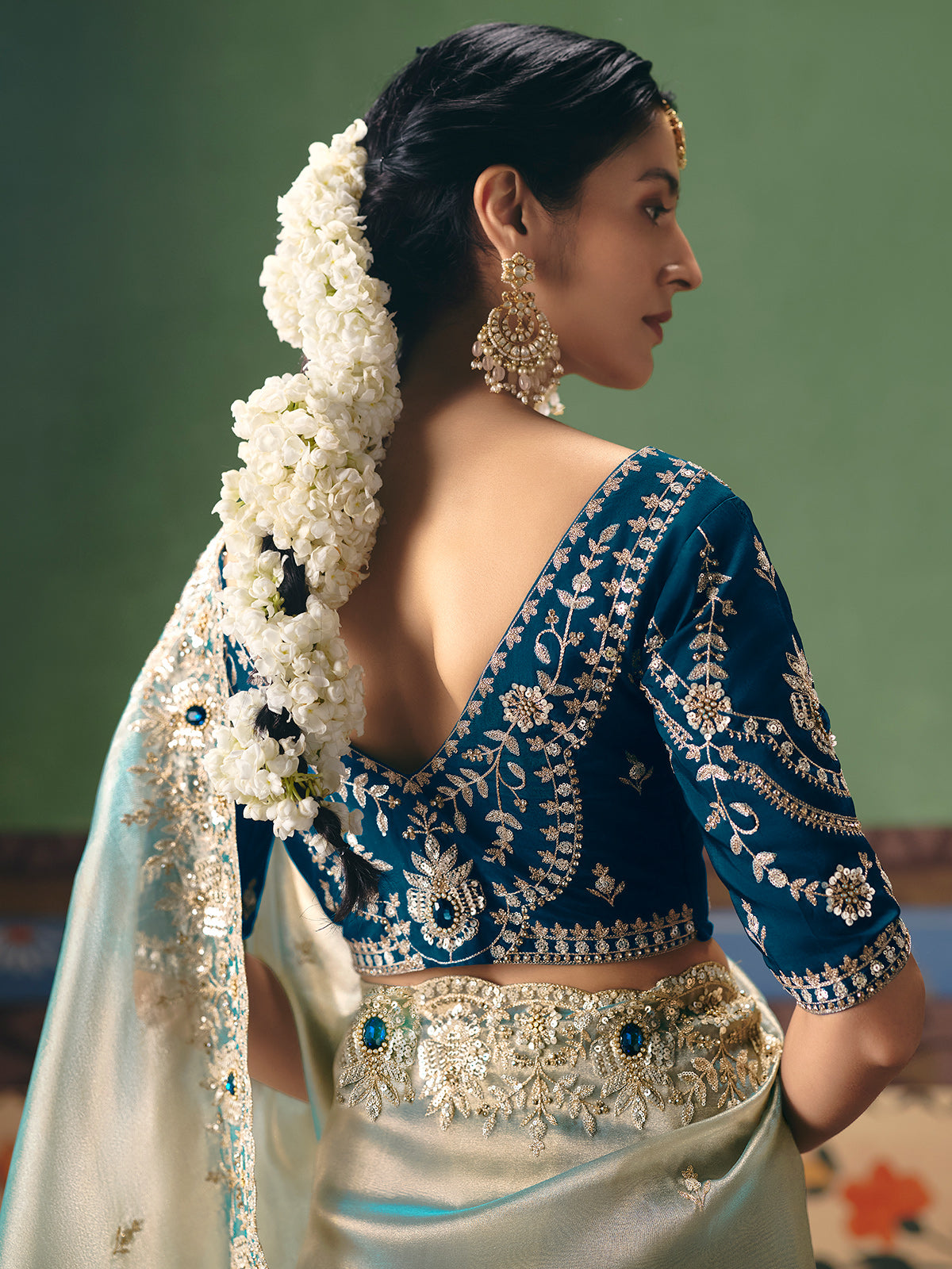Mint blue fancy silk saree with rich embellishments