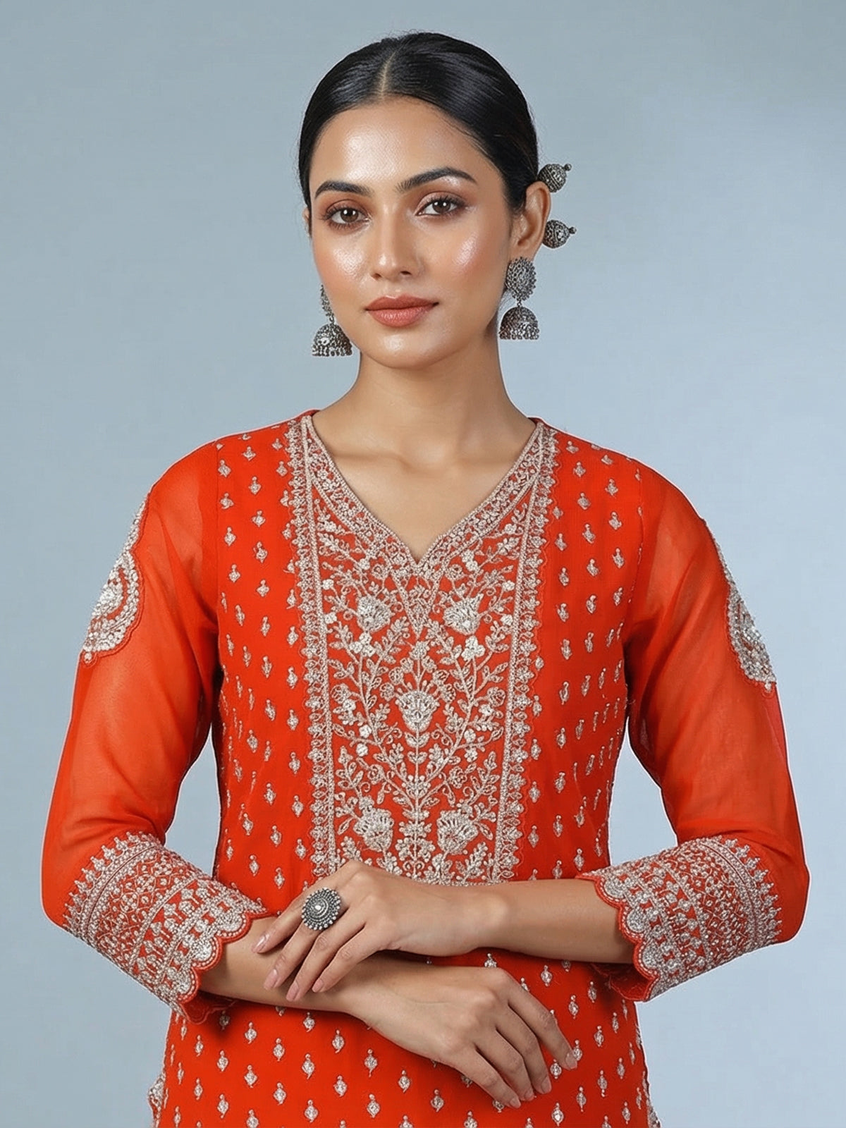 Orange georgette pakistani style embellished palazzo suit