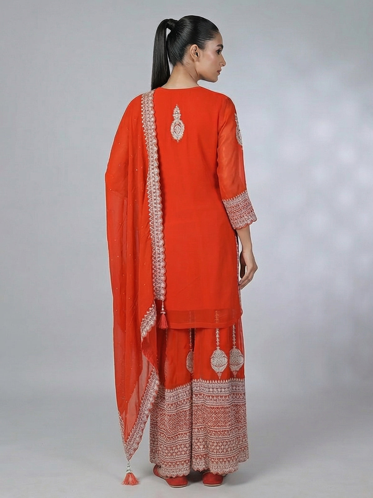 Orange georgette pakistani style embellished palazzo suit
