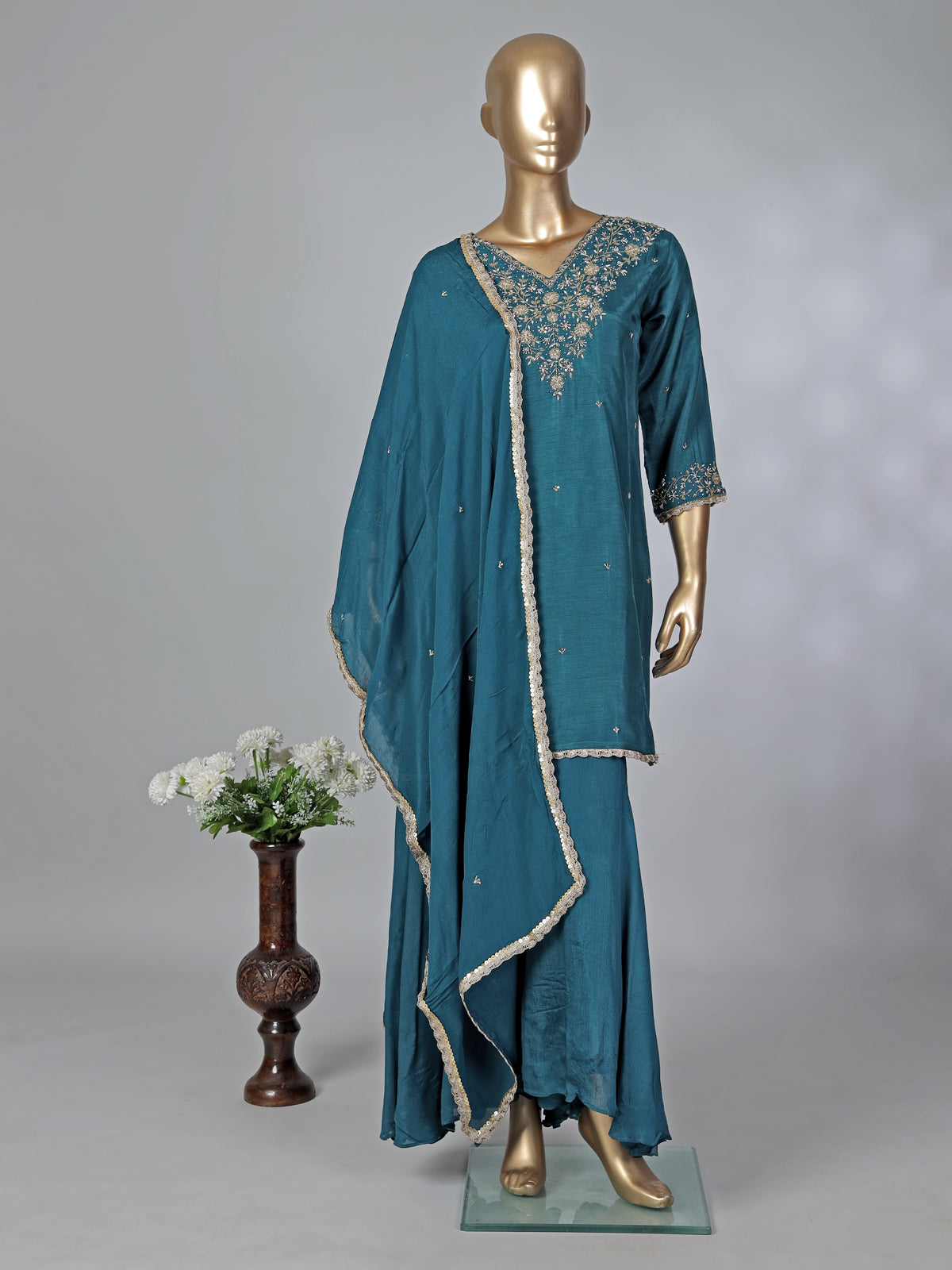 Peacock green silk zardosi embellished palazzo festive suit