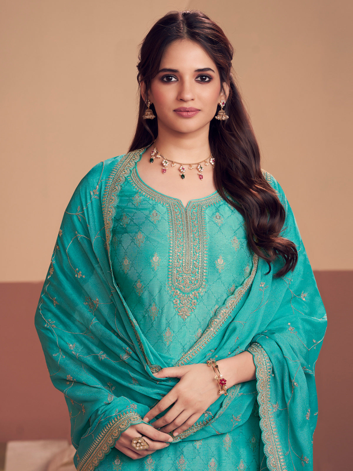 Aqua blue silk salwar suit with zari detailing
