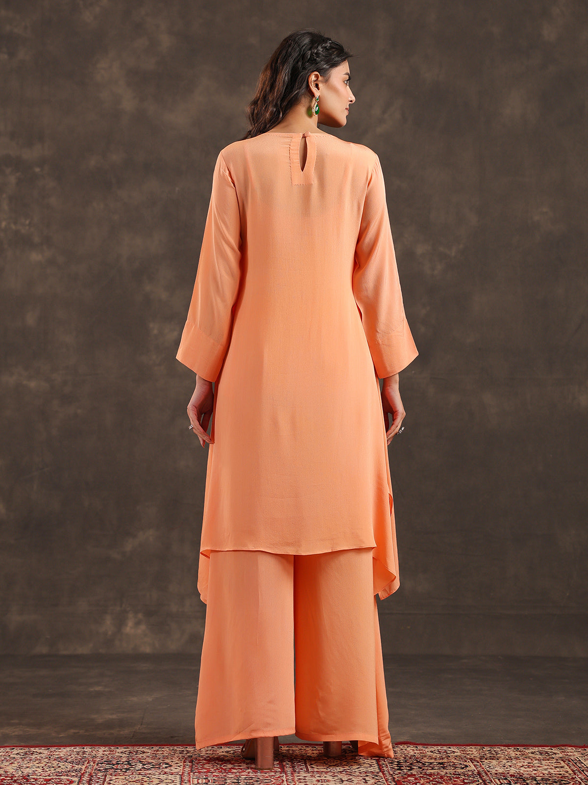Light peach yoke style palazzo suit with festive embellishments