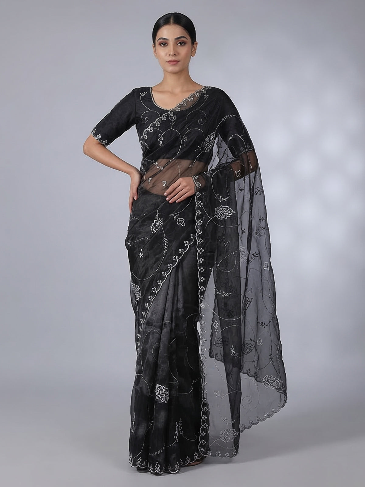 Black tissue silk saree with sequins and bead work