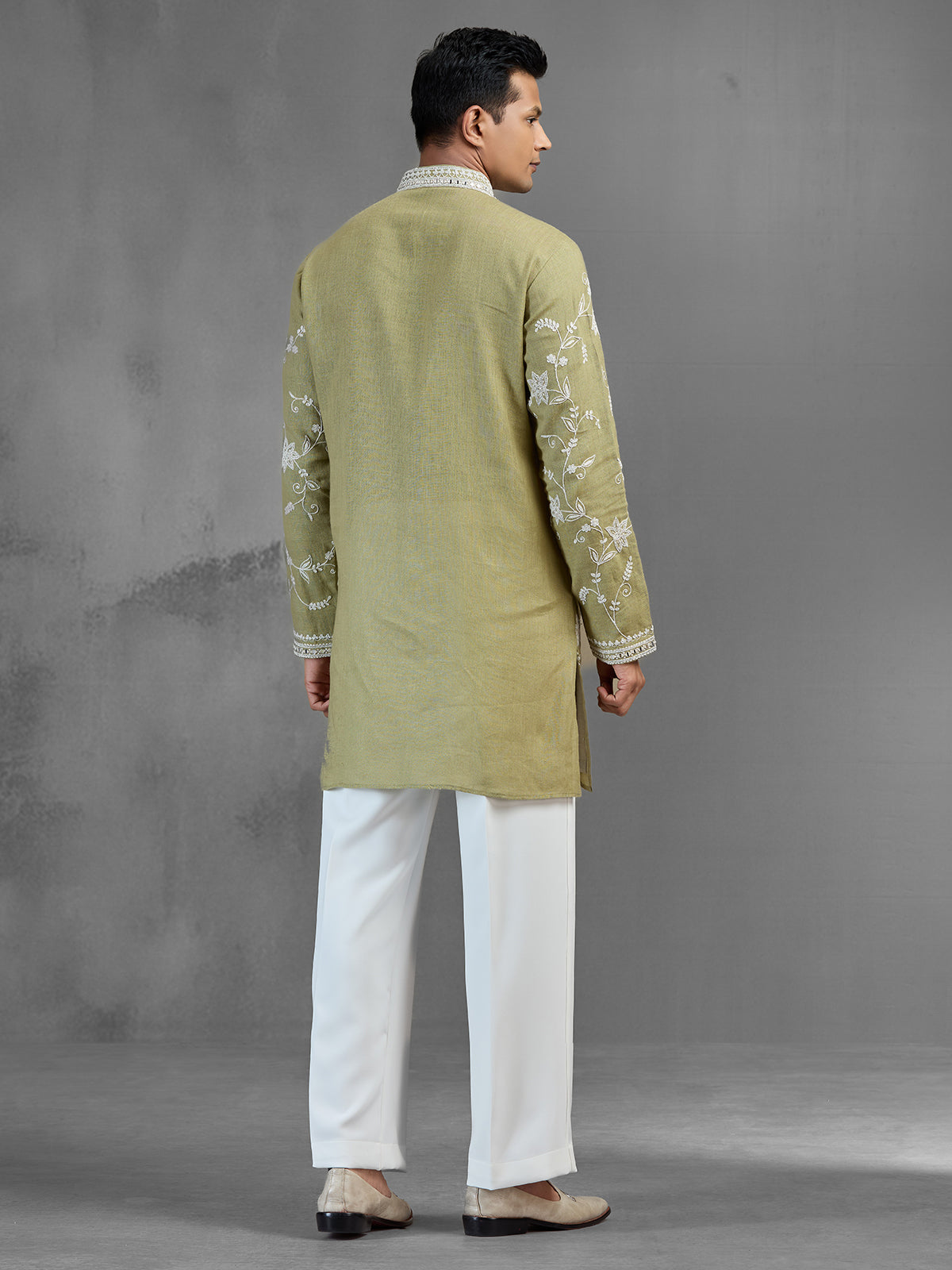 Green linen heritage aari crafted festive kurta suit