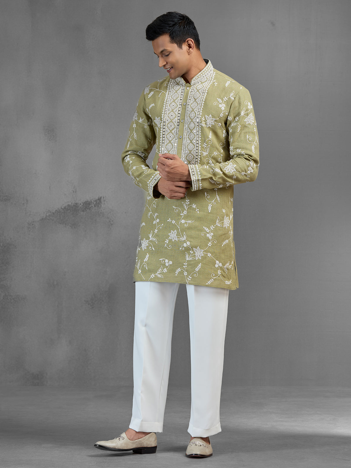 Green linen heritage aari crafted festive kurta suit