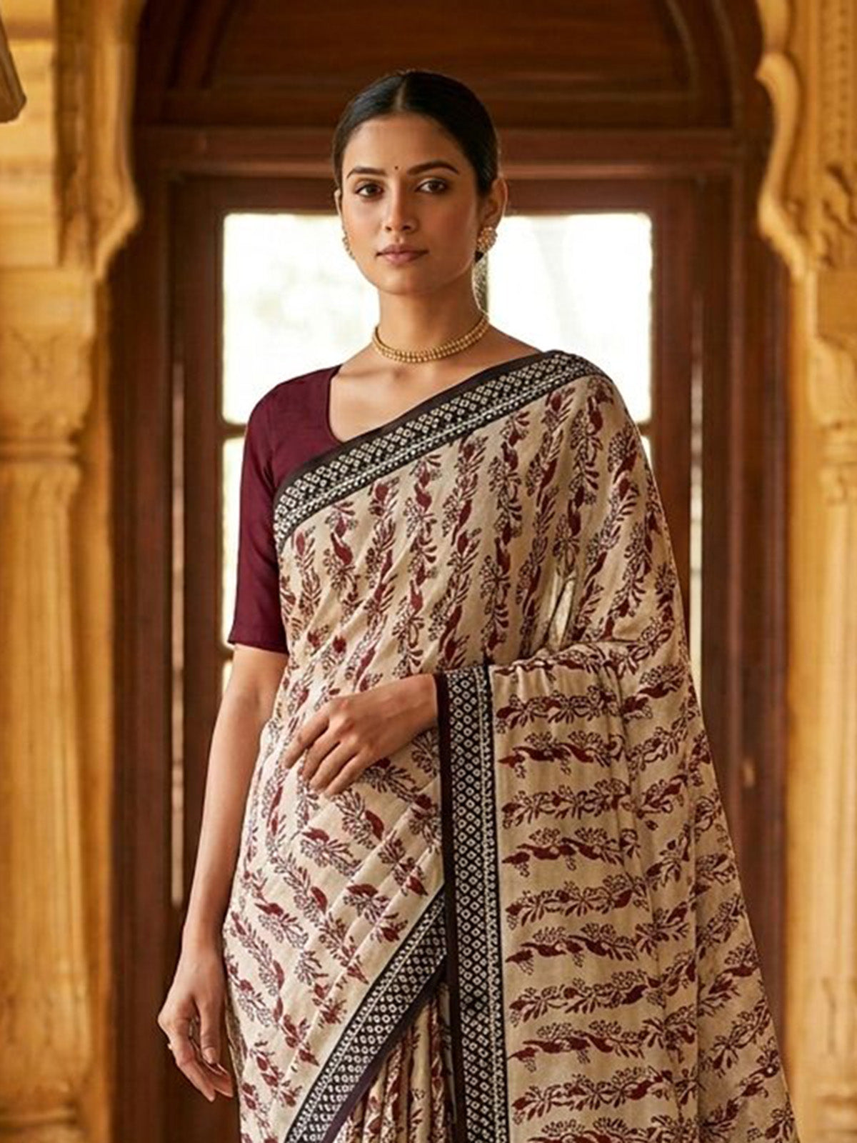 Off white muslin saree with ethnic print