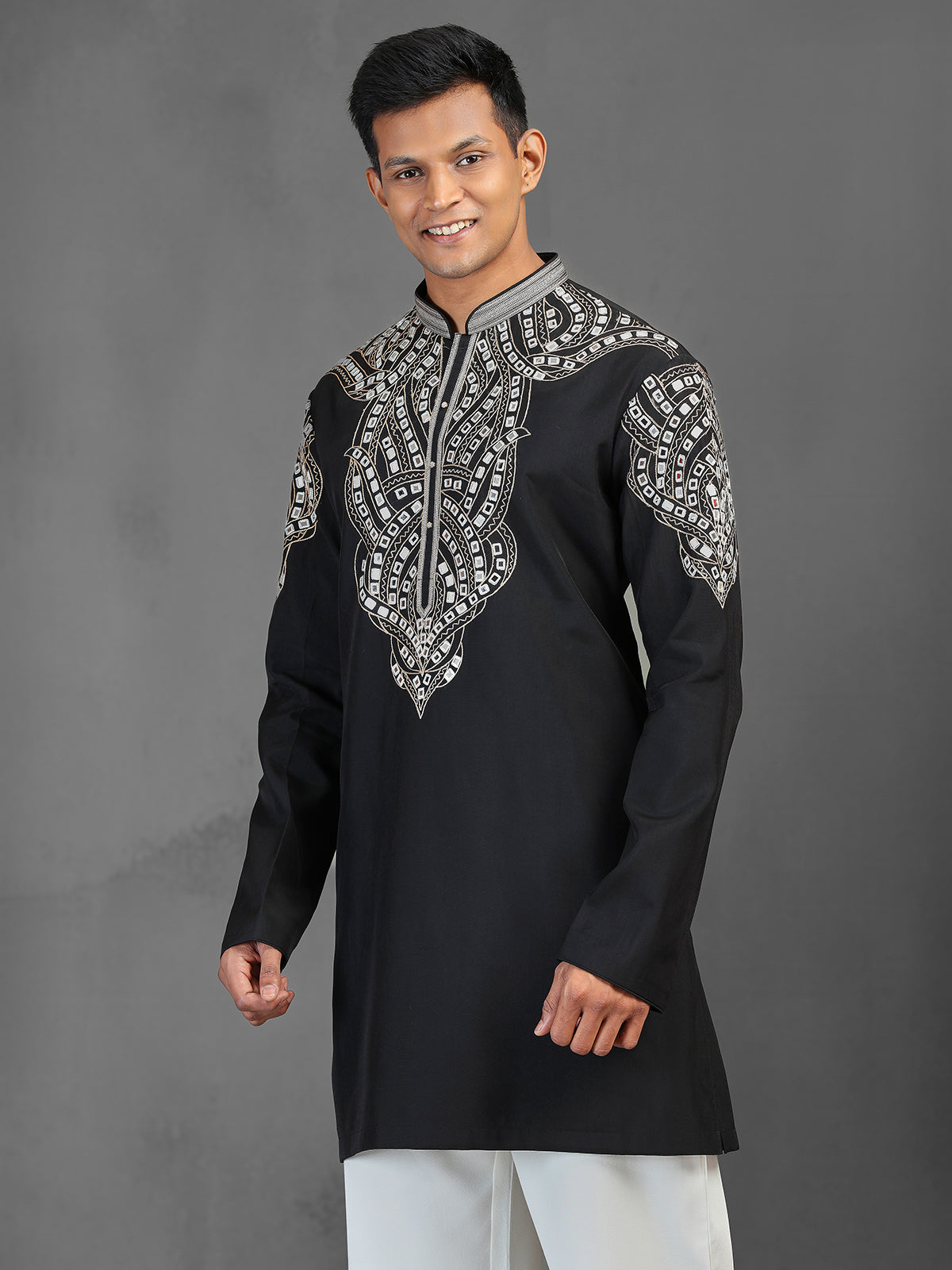 Black art silk kurta suit for a charming wedding look