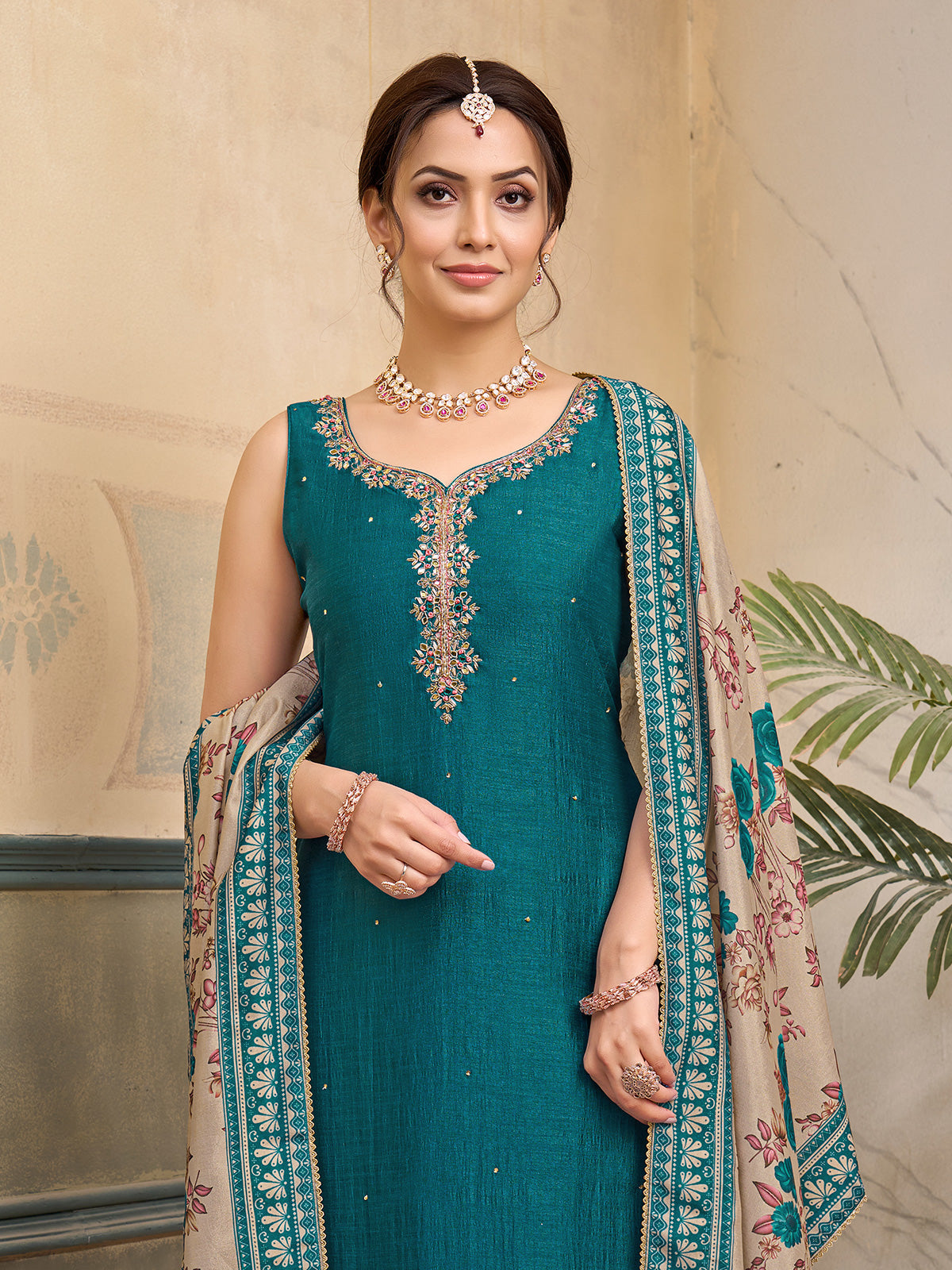 Peacock green silk sleeveless embellished festive salwar suit