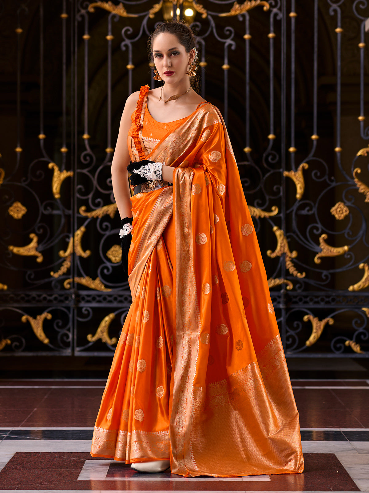 Vibrant orange satin crepe silk festive wear saree