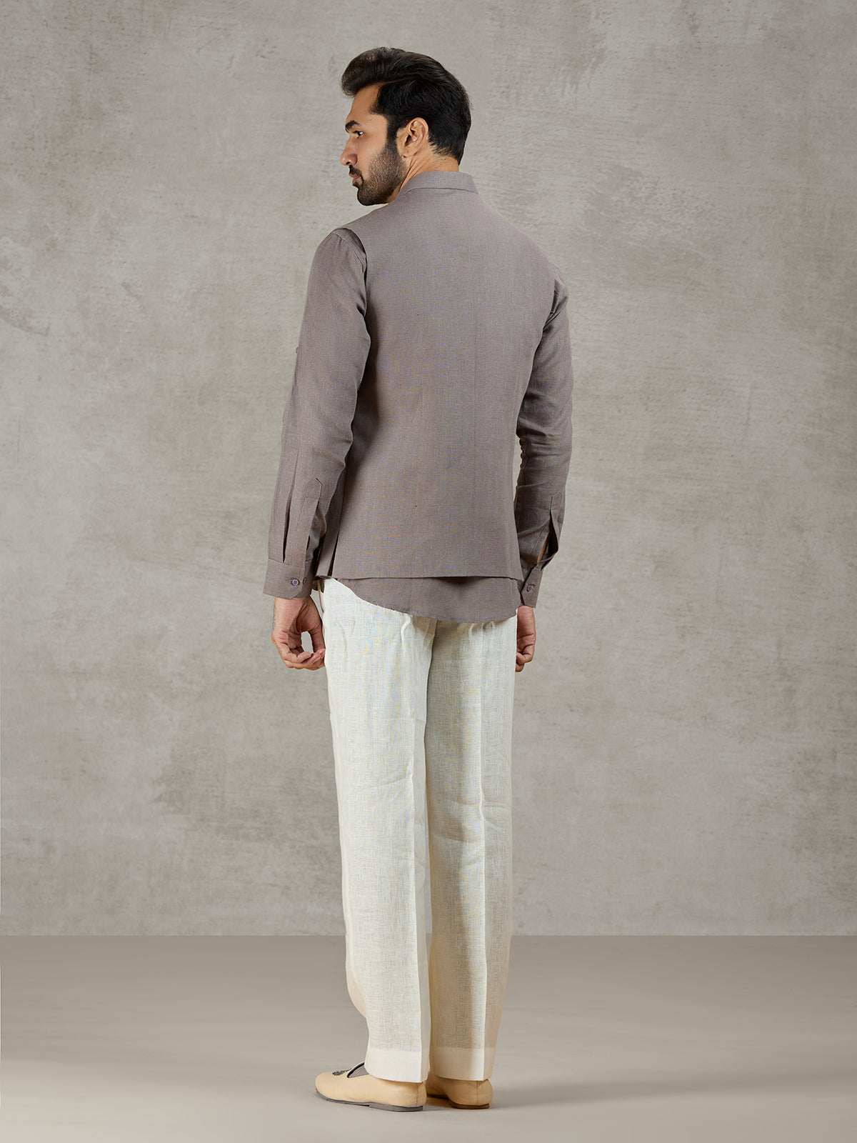 Grey linen waistcoat set with zardosi embellished crest