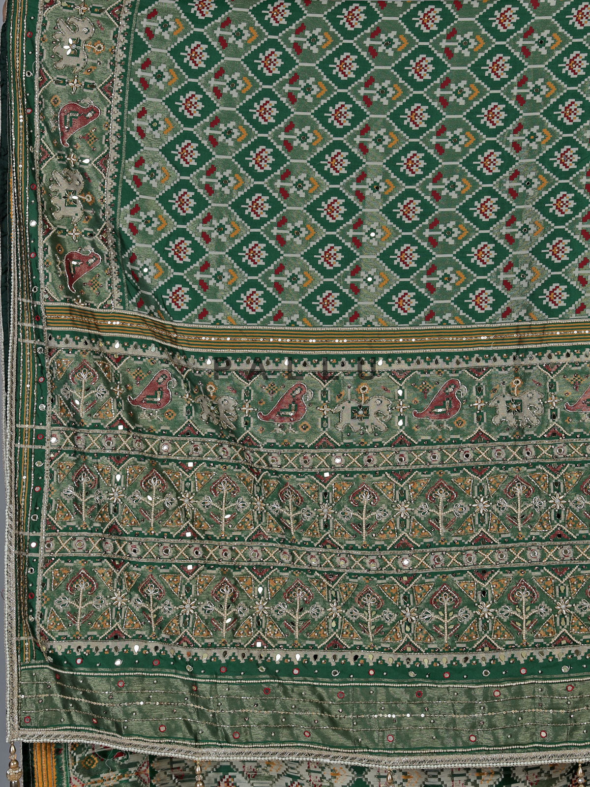 Green art patola silk saree with sequins and zardosi accents