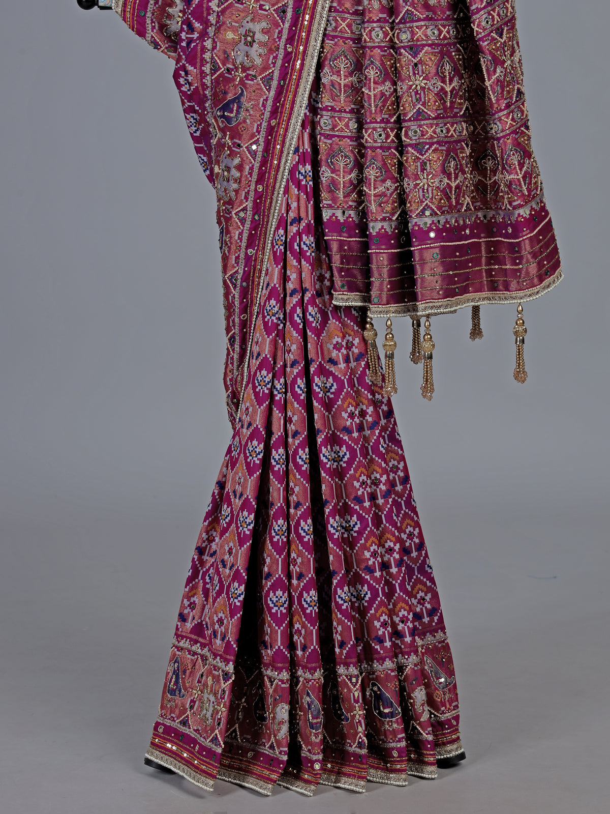 Regal purple art patola silk saree with ornate embellishments