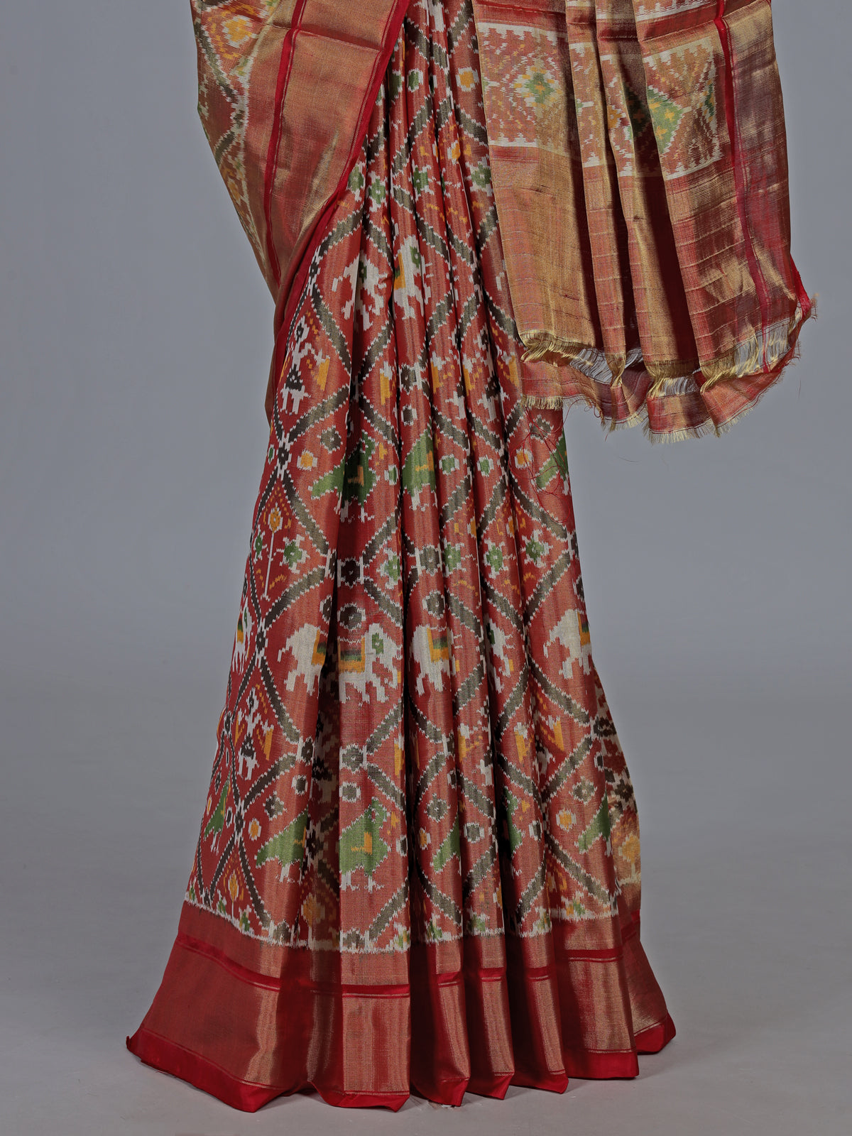 Light brown hyderabadi patola silk saree with heritage motifs