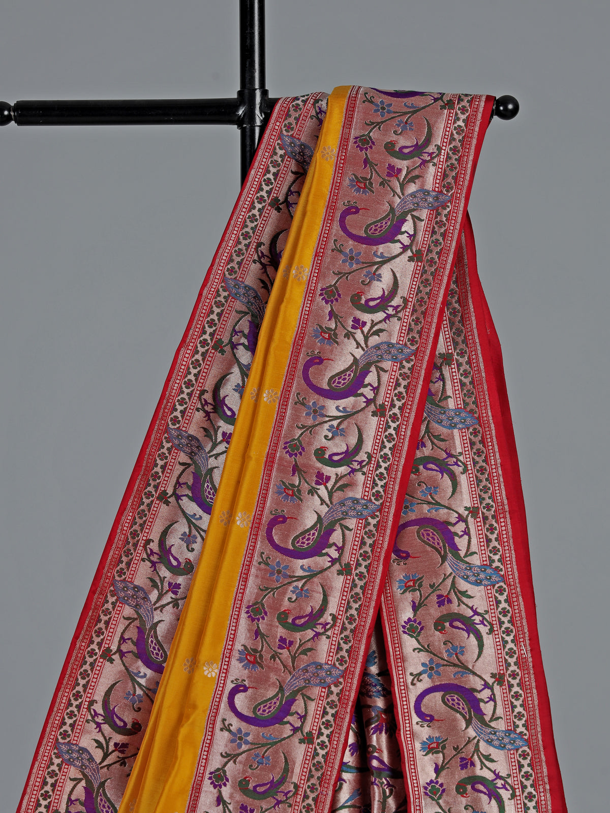 Mustard yellow banarasi silk saree with peacock zari border