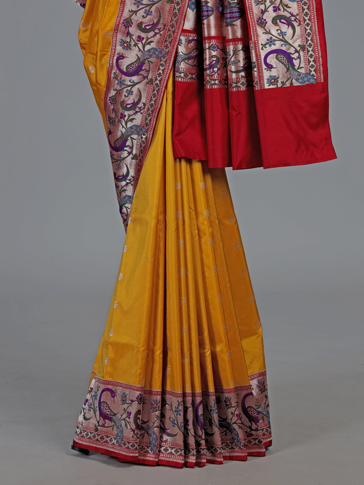 Mustard yellow banarasi silk saree with peacock zari border