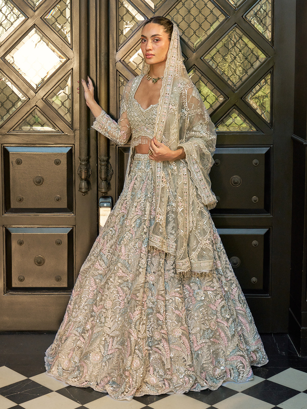 Mint blue net lehenga choli with floral resham and sequin work