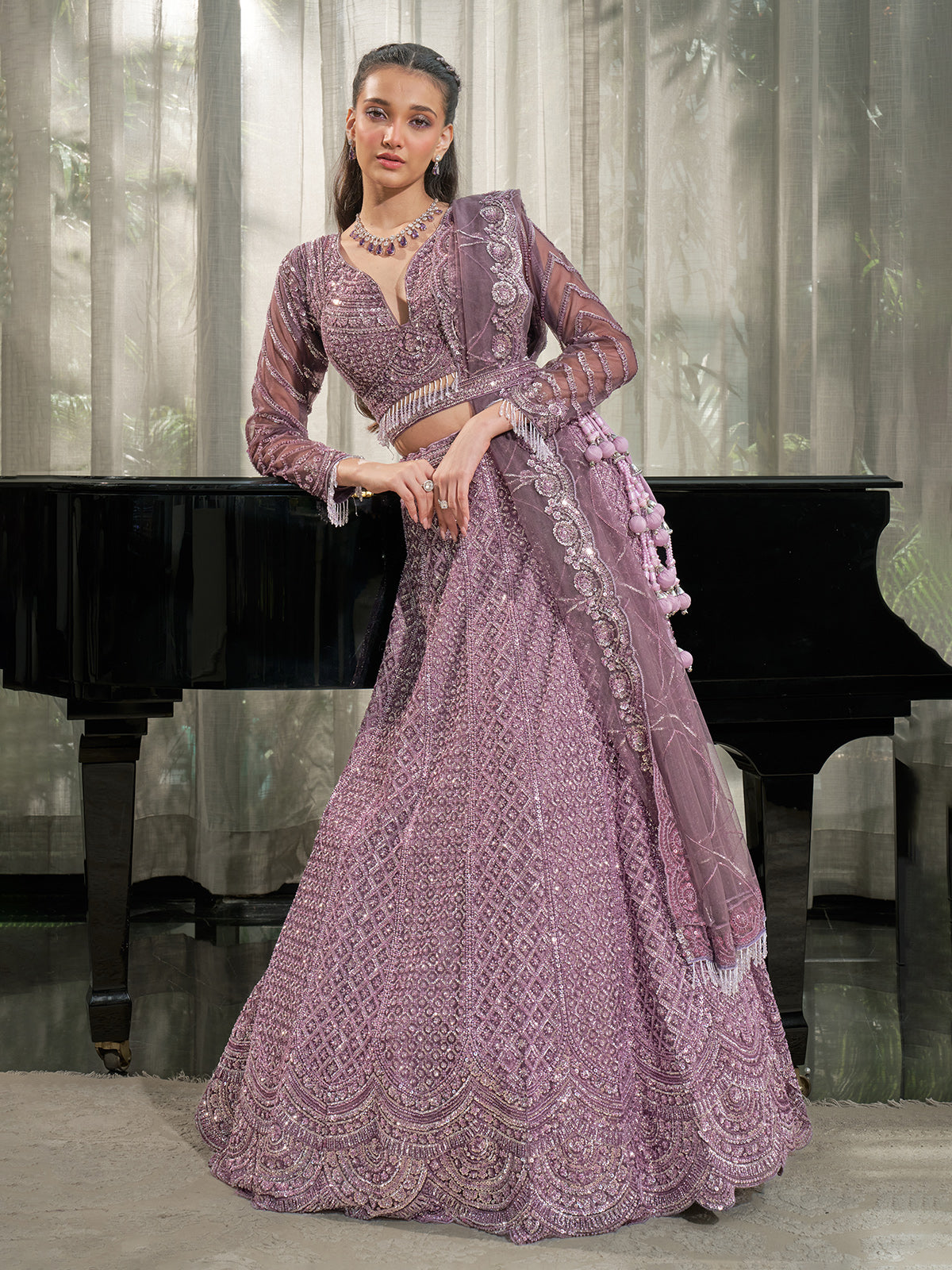 Dusty lavender net designer lehenga choli with cutdana and beads