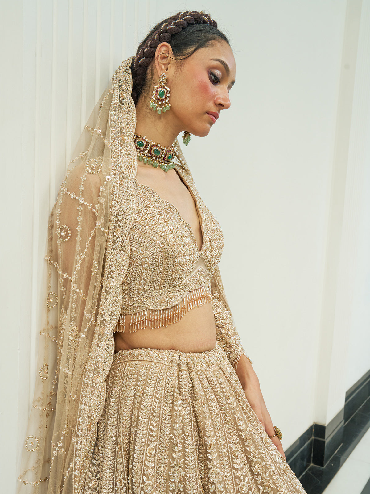 Beige net heavy embroidered lehenga choli with diamond and cutdana