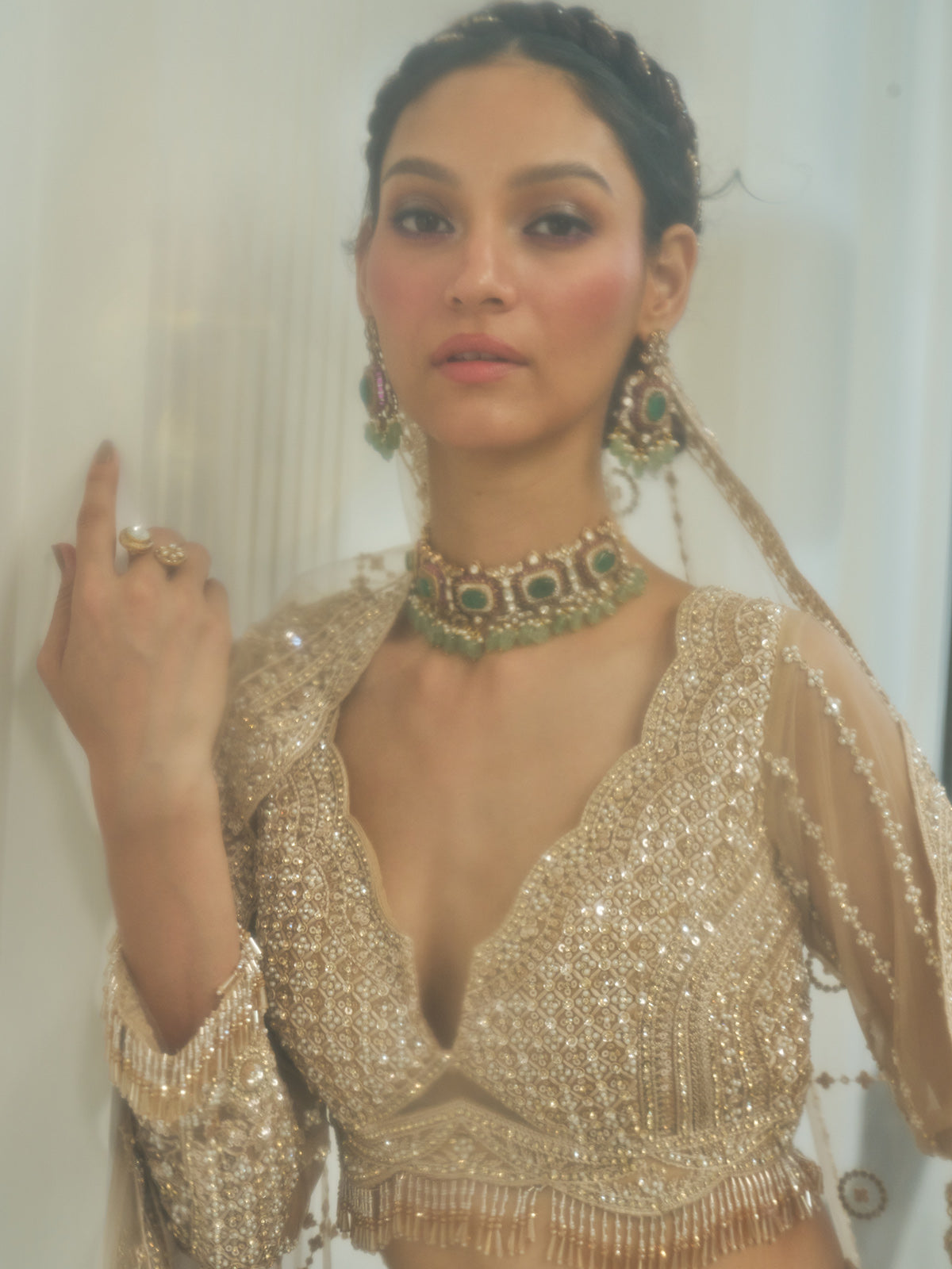 Beige net heavy embroidered lehenga choli with diamond and cutdana