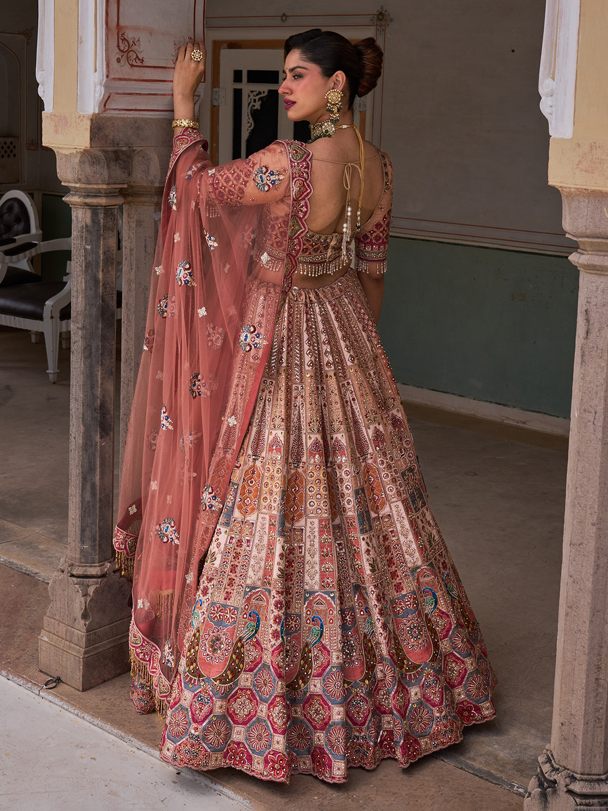 Cream silk net designer lehenga choli with multicolor resham work
