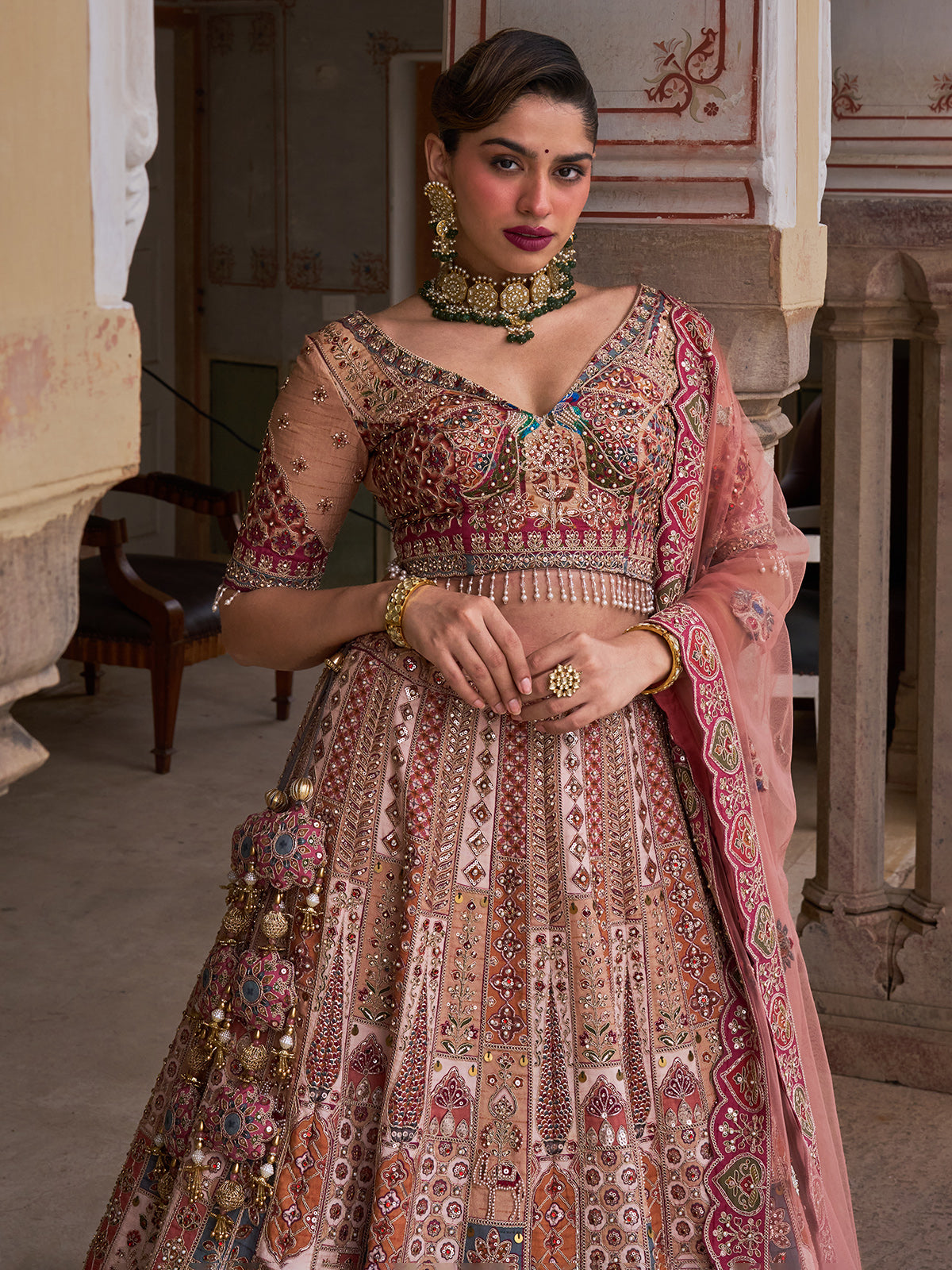 Cream silk net designer lehenga choli with multicolor resham work