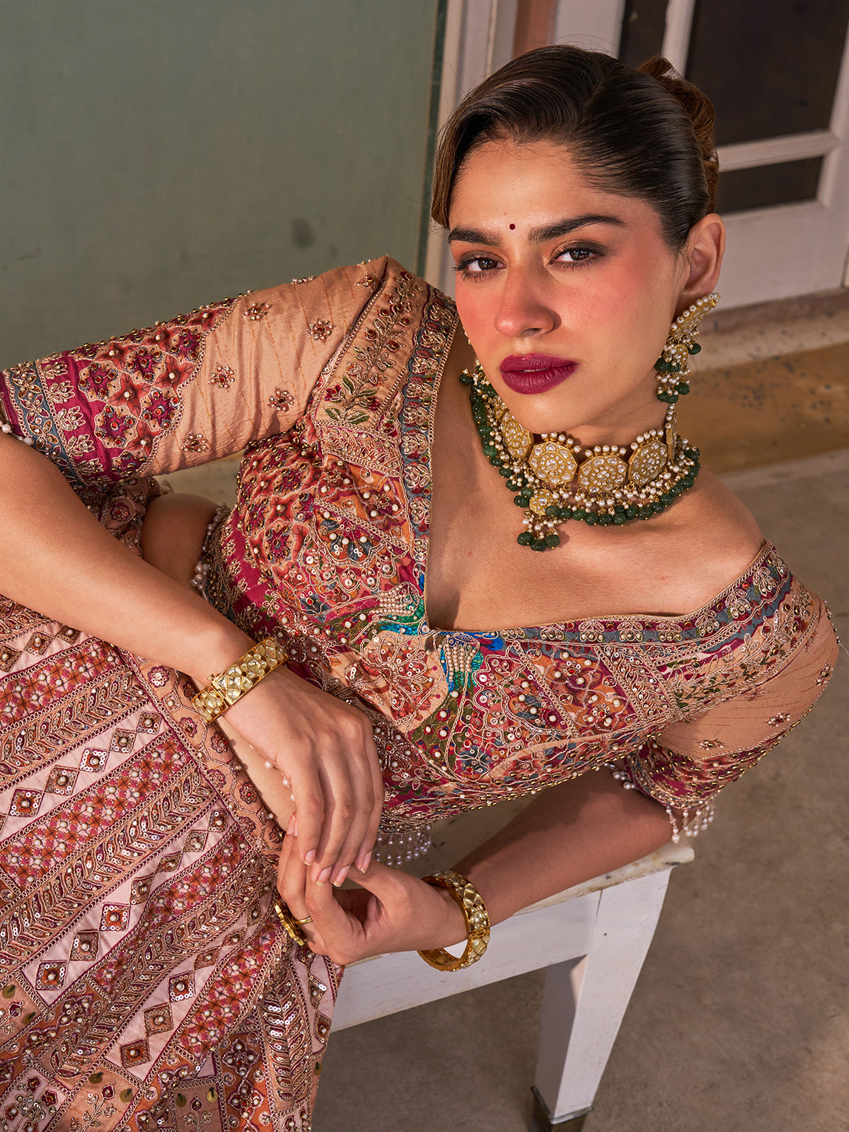 Cream silk net designer lehenga choli with multicolor resham work