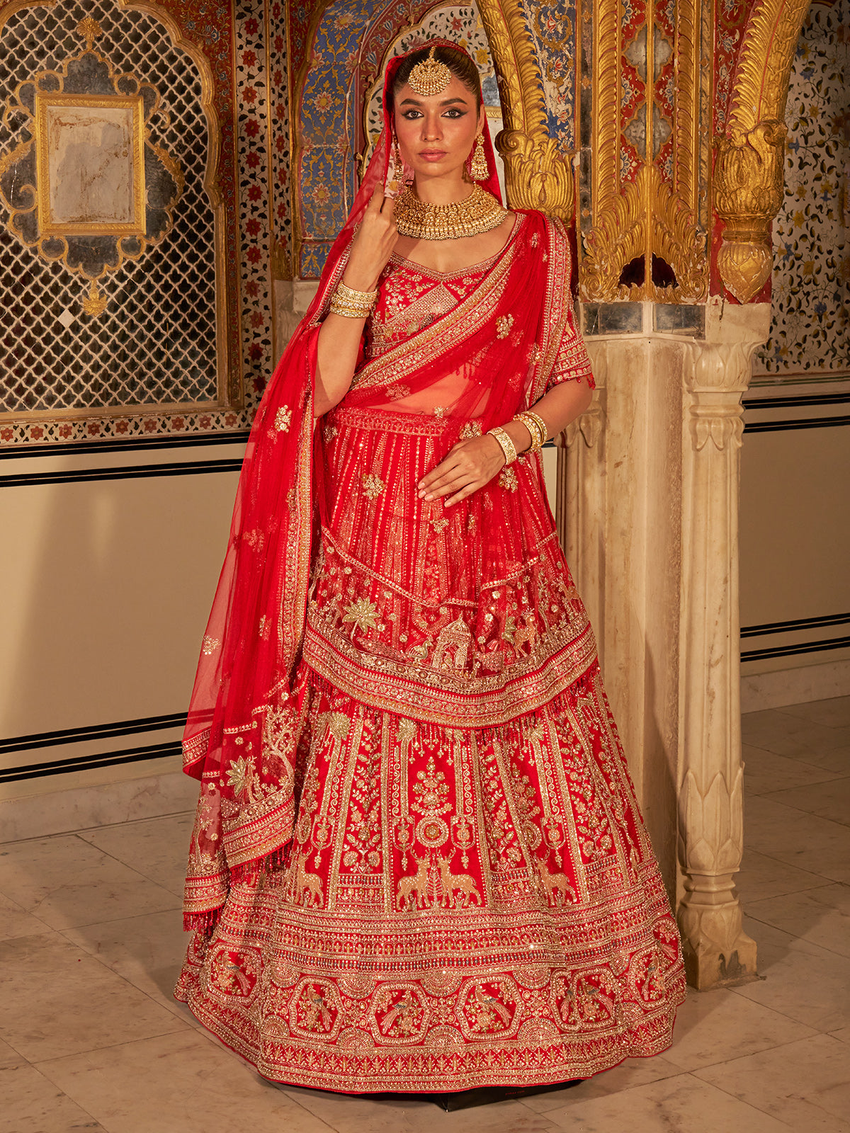 Red silk net bridal lehenga choli with traditional work