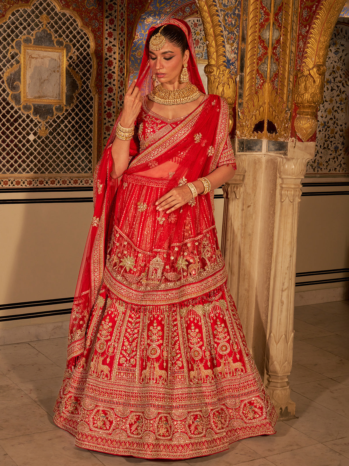 Red silk net bridal lehenga choli with traditional work