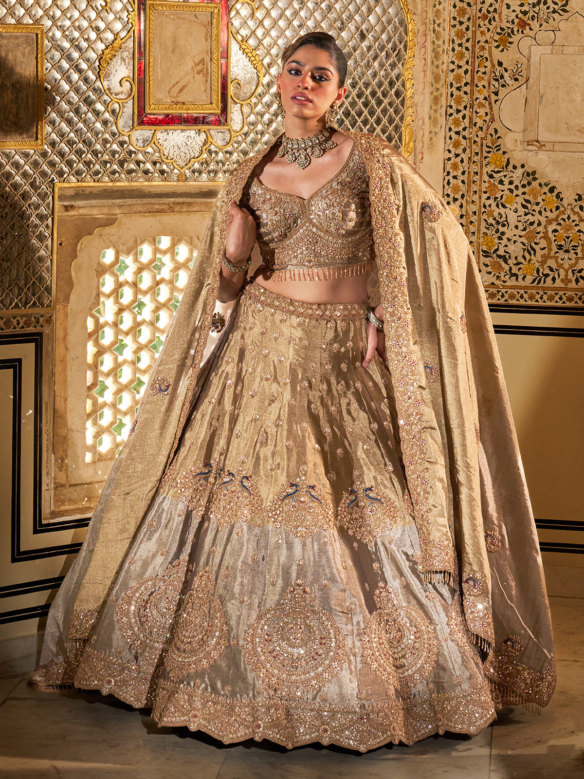 Gold and grey silk lehenga choli with dabka and peacock motifs