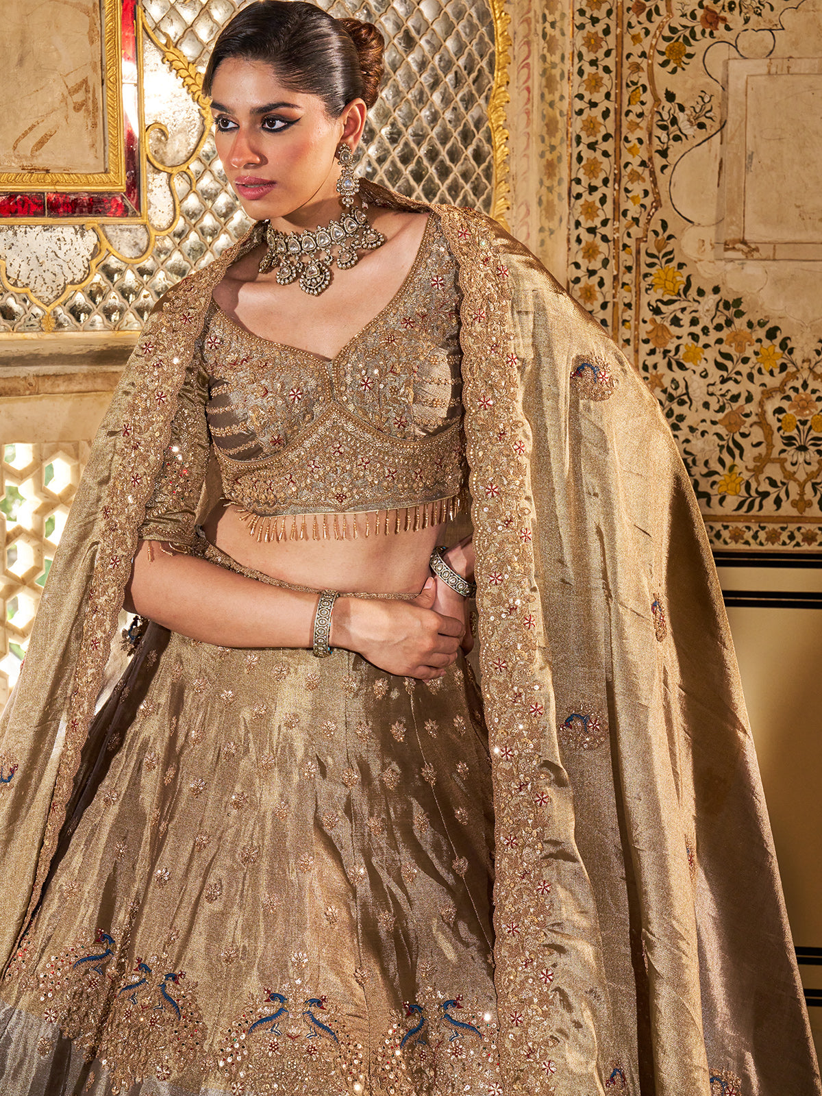 Gold and grey silk lehenga choli with dabka and peacock motifs