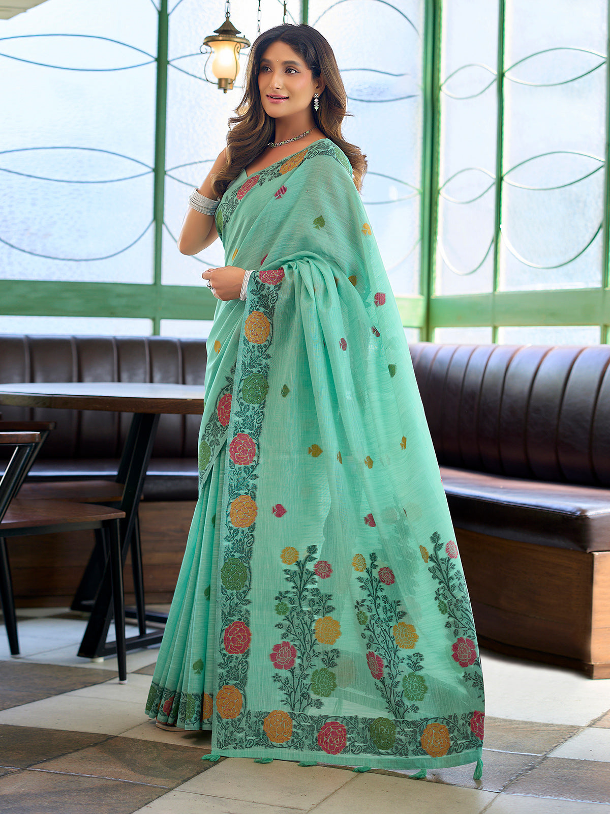 Sophisticated seafoam green cotton linen saree with floral design