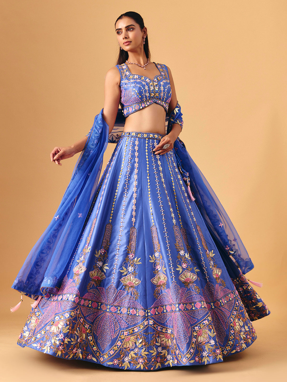Royal blue silk lehenga choli with pearl embellished artistry